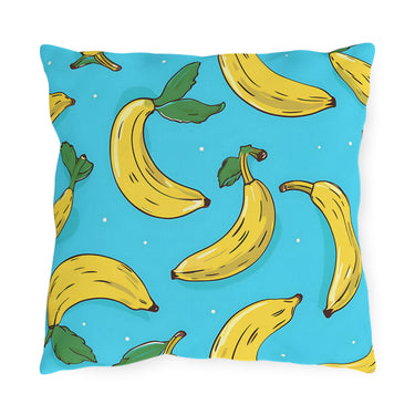 Pillow with banana pattern on a blue background